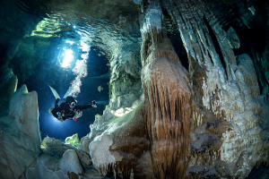 Kim Delnegro diving in underwater cave